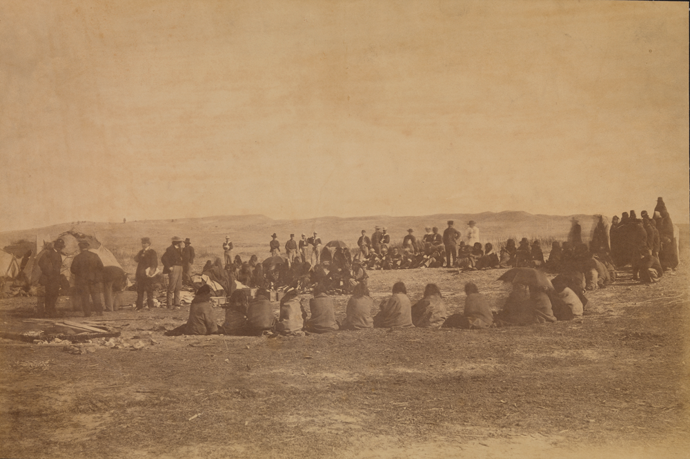 Negotiations at the Fort Laramie Peace Treaty, ending Red Cloud's War, 1868, one of the last major treaties signed before Congress voted to end U.S. treaty-making with the Indian tribal Nations. Photo by Alexander Gardner. 1868. Photo Archives, National Museum of the American Indian P10112
